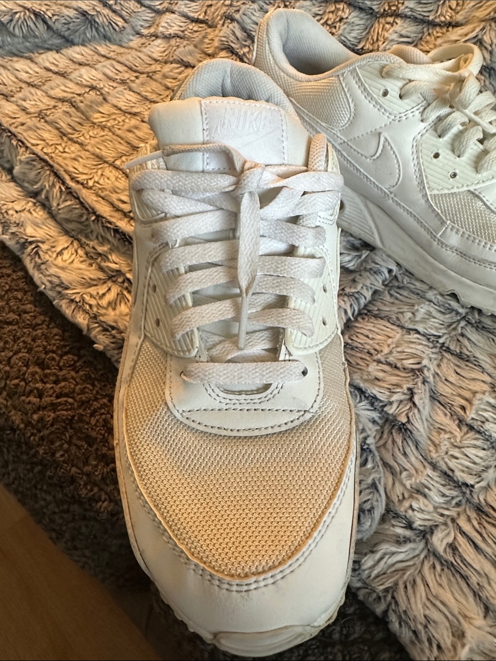 classic Nike Air Max 90 in the popular "Triple White" colorway